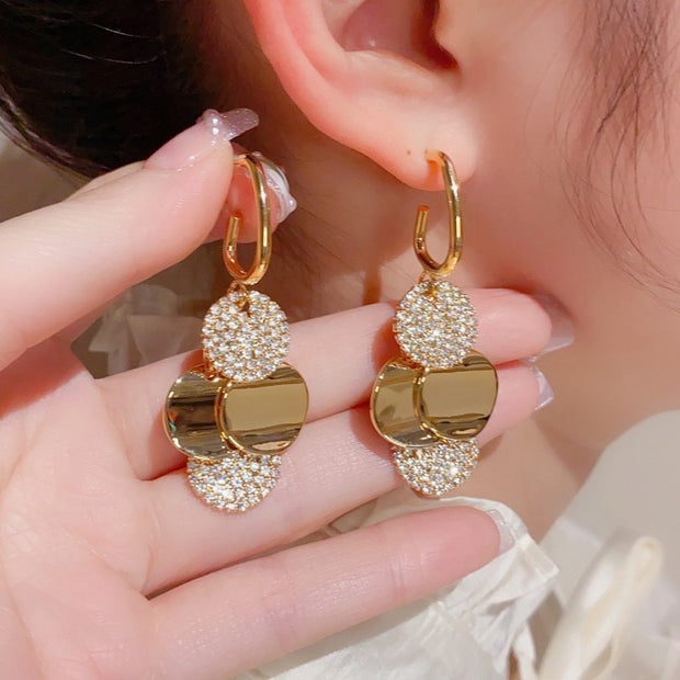 Metal disc tassel earrings